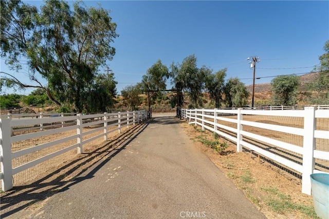 8873 Reche Canyon Rd, Colton, CA 92324 - view of asphalt driveway featuring a gated entry