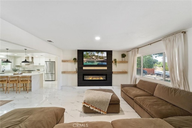 8873 Reche Canyon Rd, Colton, CA 92324 - living room with a fireplace, recessed lighting, and light marble finish floors