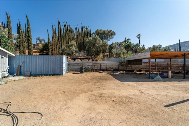 8873 Reche Canyon Rd, Colton, CA 92324 - view of yard with an outdoor structure, an exterior structure, and a mountain view