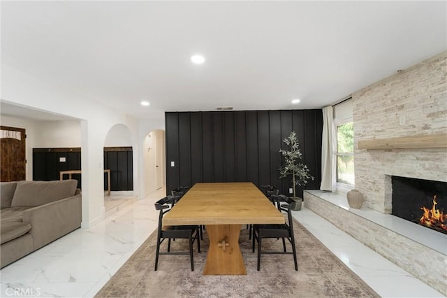 8873 Reche Canyon Rd, Colton, CA 92324 - dining room with recessed lighting, arched walkways, a fireplace, and marble finish floors