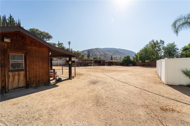 8873 Reche Canyon Rd, Colton, CA 92324 - view of yard with a mountain view and an exterior structure