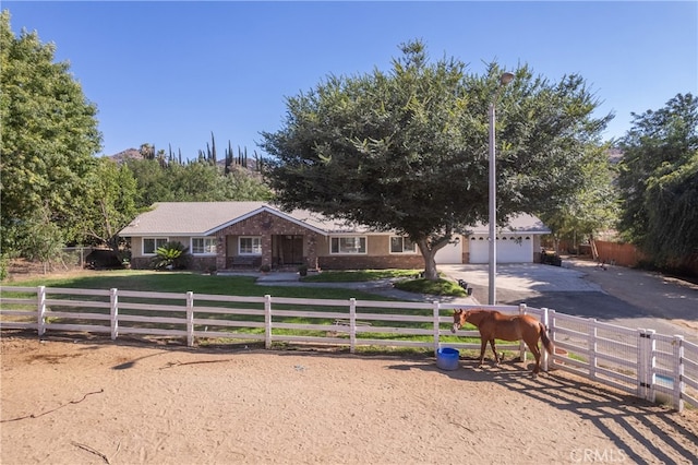 8873 Reche Canyon Rd, Colton, CA 92324 - ranch-style home with concrete driveway and a garage