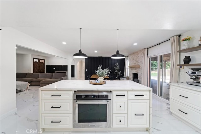 8873 Reche Canyon Rd, Colton, CA 92324 - kitchen featuring stainless steel oven, light marble finish floors, light stone counters, open floor plan, and open shelves