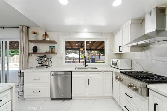 8873 Reche Canyon Rd, Colton, CA 92324 - kitchen featuring wall chimney exhaust hood, appliances with stainless steel finishes, white cabinets, and recessed lighting