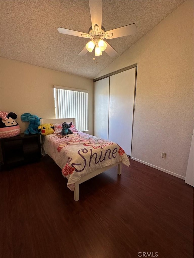 37510 Conifer Dr, Palmdale, CA 93550 - bedroom featuring lofted ceiling, dark wood-type flooring, a closet, a textured ceiling, and a ceiling fan