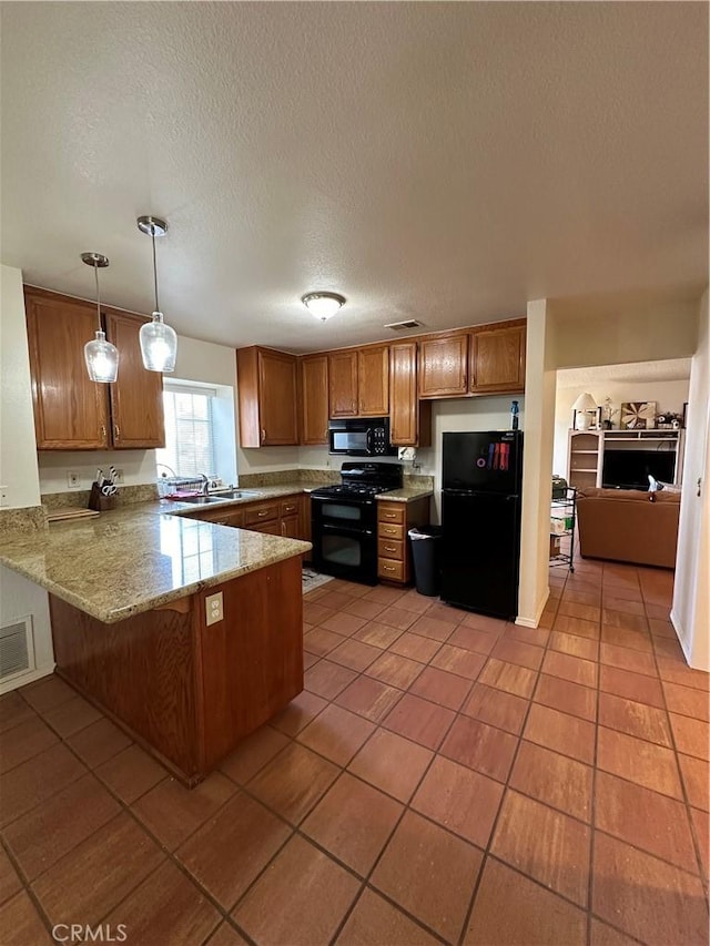 37510 Conifer Dr, Palmdale, CA 93550 - kitchen featuring black appliances, a peninsula, brown cabinetry, light tile patterned floors, and a textured ceiling
