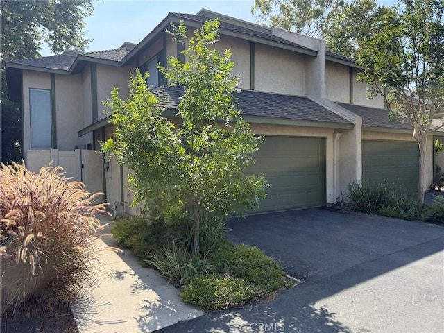 640 Juniper Way, La Habra, CA 90631 - view of front of property with stucco siding, driveway, a garage, and roof with shingles