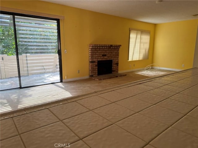 640 Juniper Way, La Habra, CA 90631 - unfurnished living room featuring a brick fireplace and carpet floors
