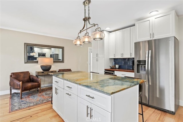 23906 Fernmead Ln, Harbor City, CA 90710 - kitchen with appliances with stainless steel finishes, light wood-type flooring, white cabinetry, light stone counters, and recessed lighting