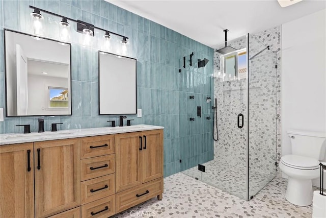 23906 Fernmead Ln, Harbor City, CA 90710 - bathroom featuring a shower stall, double vanity, tile walls, and tile patterned flooring