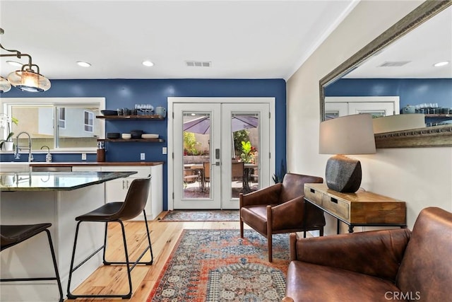 23906 Fernmead Ln, Harbor City, CA 90710 - living room with french doors, healthy amount of natural light, light wood finished floors, and recessed lighting