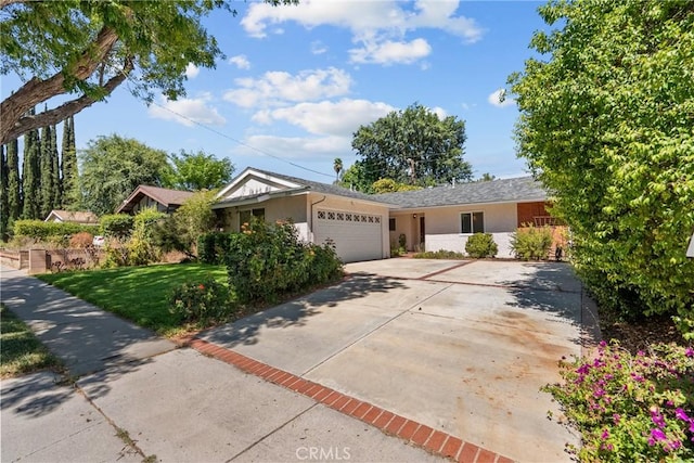 27124 Cabrera Ave, Saugus, CA 91350 - ranch-style home featuring a garage, a front lawn, concrete driveway, and stucco siding