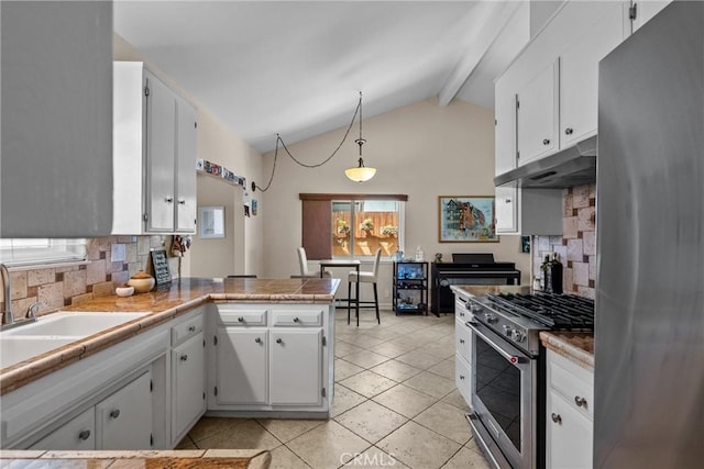 27124 Cabrera Ave, Saugus, CA 91350 - kitchen with stainless steel appliances, under cabinet range hood, tasteful backsplash, and white cabinets
