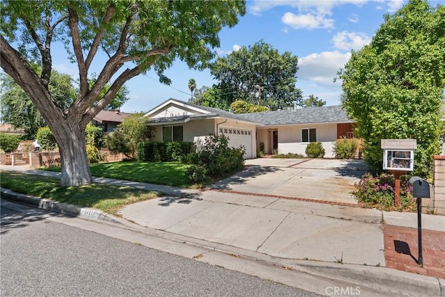 27124 Cabrera Ave, Saugus, CA 91350 - ranch-style home with a garage, driveway, stucco siding, and a front yard