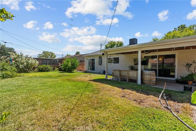 27124 Cabrera Ave, Saugus, CA 91350 - back of house featuring stucco siding, a yard, and a patio