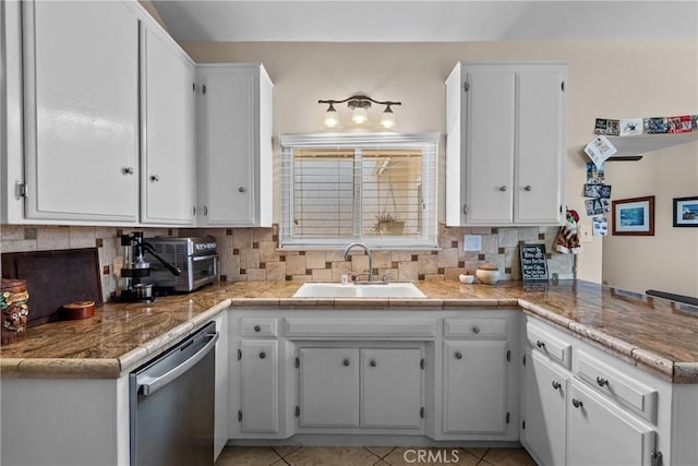 27124 Cabrera Ave, Saugus, CA 91350 - kitchen featuring dishwasher, white cabinets, backsplash, and a peninsula