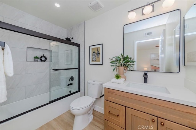 1615 Via Linda Unit 16, Fullerton, CA 92833 - full bathroom featuring vanity, enclosed tub / shower combo, and wood finished floors