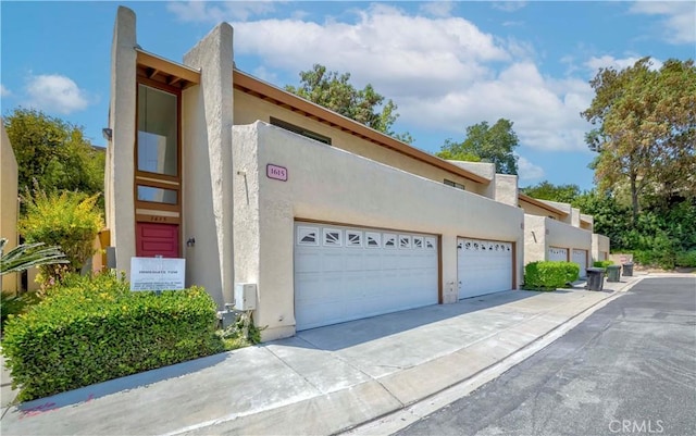 1615 Via Linda Unit 16, Fullerton, CA 92833 - view of front of property featuring stucco siding and concrete driveway