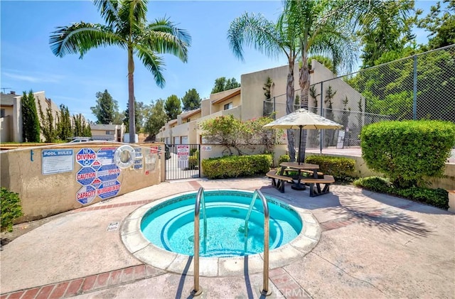 1615 Via Linda Unit 16, Fullerton, CA 92833 - view of pool with a hot tub and a gate