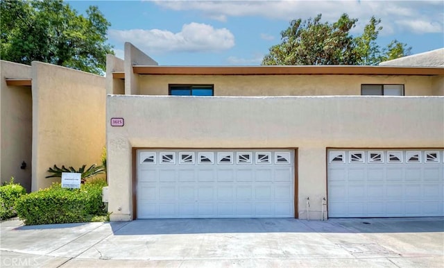 1615 Via Linda Unit 16, Fullerton, CA 92833 - view of front facade featuring concrete driveway, stucco siding, and a garage