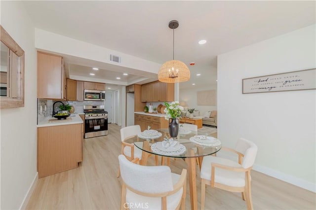 1615 Via Linda Unit 16, Fullerton, CA 92833 - dining area with light wood-style floors and recessed lighting