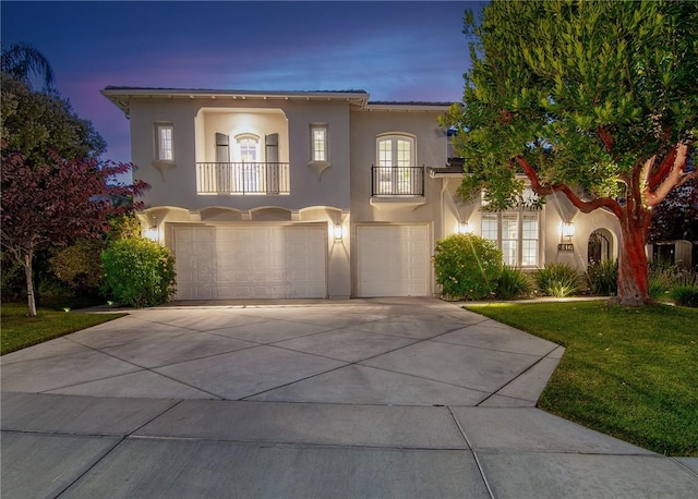 3417 Kildare Ct, Burbank, CA 91504 - mediterranean / spanish-style home with a balcony, a garage, stucco siding, and concrete driveway