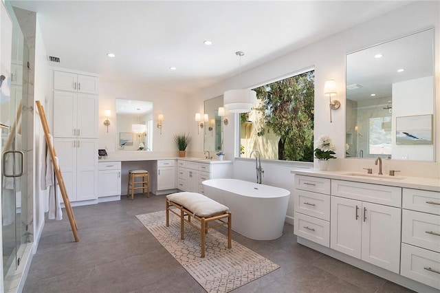 3417 Kildare Ct, Burbank, CA 91504 - bathroom featuring a stall shower, two vanities, a freestanding tub, recessed lighting, and tile patterned flooring