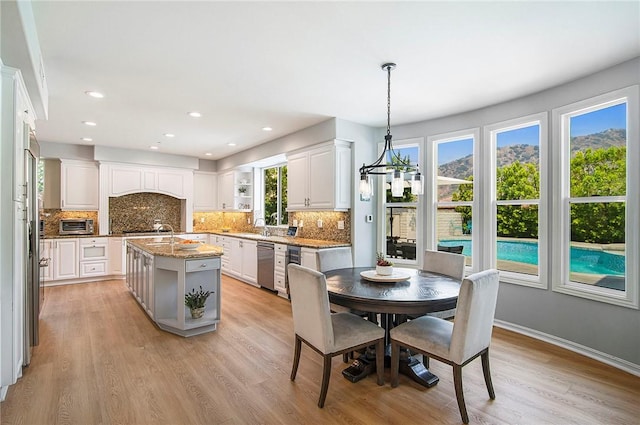 3417 Kildare Ct, Burbank, CA 91504 - dining space featuring light wood finished floors, recessed lighting, and a chandelier