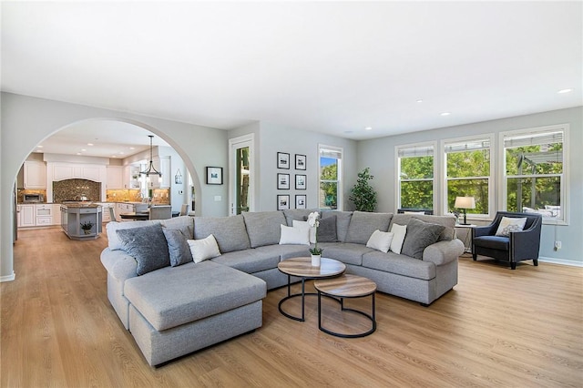 3417 Kildare Ct, Burbank, CA 91504 - living room with arched walkways, light wood-style flooring, and recessed lighting