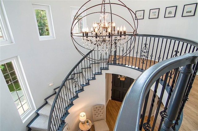 3417 Kildare Ct, Burbank, CA 91504 - stairway featuring a chandelier, a high ceiling, and wood finished floors