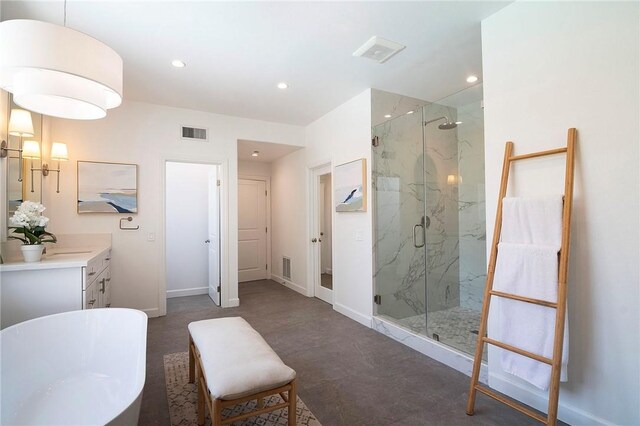 3417 Kildare Ct, Burbank, CA 91504 - bathroom featuring a marble finish shower, a freestanding bath, vanity, and recessed lighting