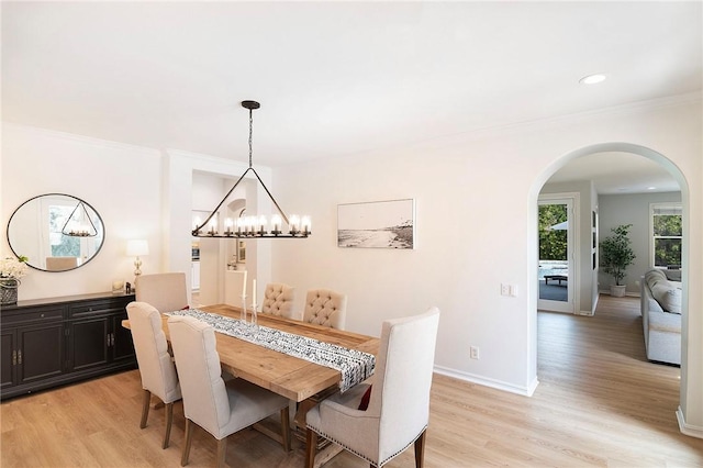 3417 Kildare Ct, Burbank, CA 91504 - dining space featuring arched walkways, light wood-style floors, a chandelier, crown molding, and recessed lighting