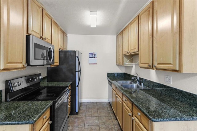 390 N 1st St Unit 23, El Cajon, CA 92021 - kitchen with appliances with stainless steel finishes and dark stone counters