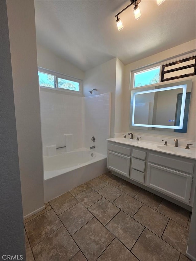 29390 Crest View Ln, Highland, CA 92346 - full bath with double vanity, bathtub / shower combination, lofted ceiling, and tile patterned flooring