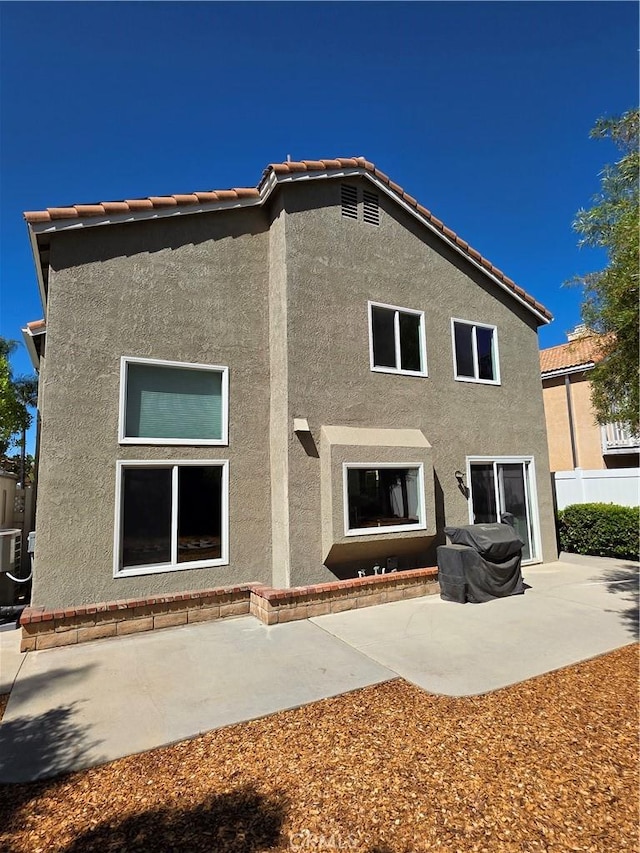 29390 Crest View Ln, Highland, CA 92346 - rear view of house with stucco siding, a patio, and a tile roof