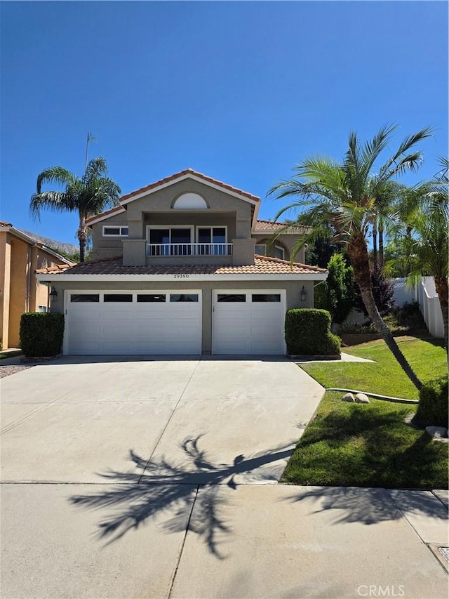 29390 Crest View Ln, Highland, CA 92346 - view of front of home featuring concrete driveway, an attached garage, stucco siding, and a front lawn