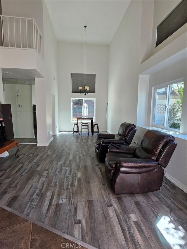 29390 Crest View Ln, Highland, CA 92346 - living room featuring a high ceiling, wood finished floors, and a chandelier