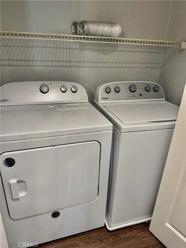 1025 La Terraza Cir Unit 204, Corona, CA 92879 - washroom featuring washer and clothes dryer and dark wood-type flooring