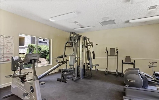 1025 La Terraza Cir Unit 204, Corona, CA 92879 - exercise room with a textured ceiling and baseboards