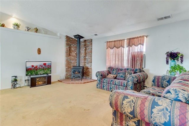 21919 Standing Rock Ave, Apple Valley, CA 92307 - carpeted living area featuring a wood stove