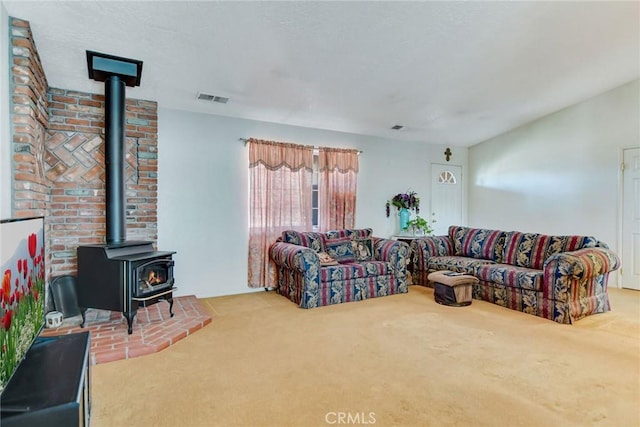 21919 Standing Rock Ave, Apple Valley, CA 92307 - carpeted living room featuring a wood stove