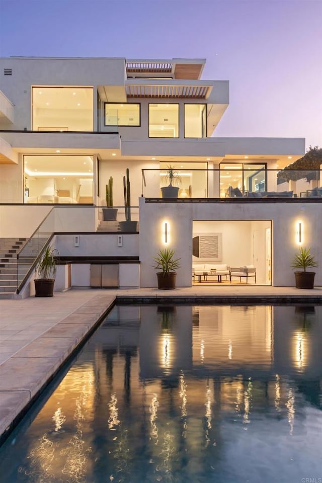 2082 Via Casa Alta, La Jolla, CA 92037 - rear view of house featuring stucco siding, stairs, and an outdoor pool