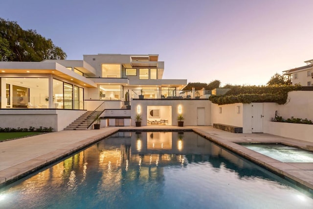 2082 Via Casa Alta, La Jolla, CA 92037 - back of property featuring an in-ground hot tub, stairway, an outdoor pool, a balcony, and a patio area
