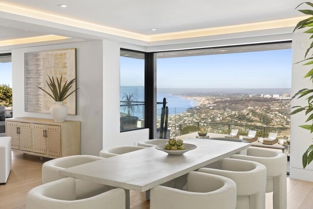 2082 Via Casa Alta, La Jolla, CA 92037 - dining room featuring wood finished floors and a water view