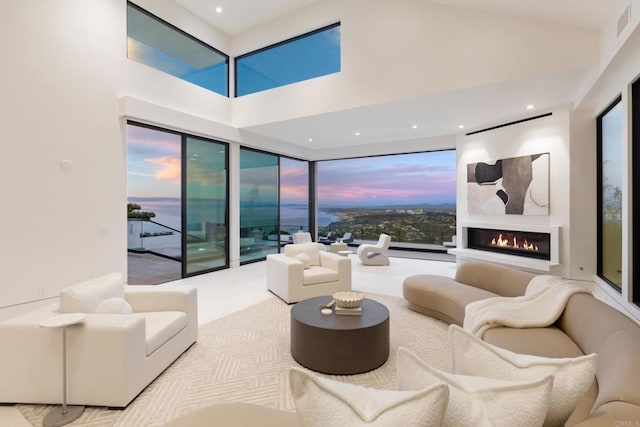 2082 Via Casa Alta, La Jolla, CA 92037 - carpeted living room with a glass covered fireplace and a high ceiling
