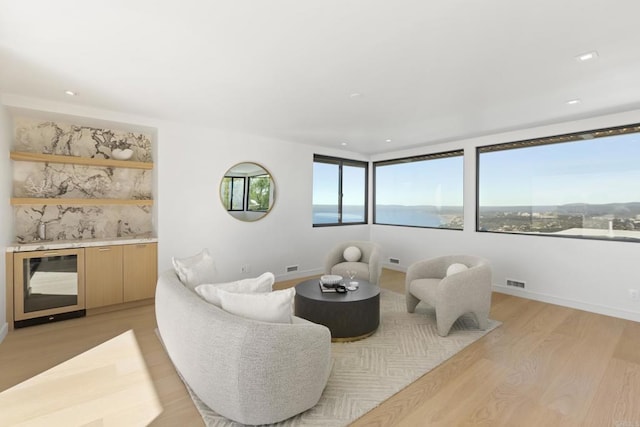 2082 Via Casa Alta, La Jolla, CA 92037 - living area featuring wine cooler, light wood-style flooring, and recessed lighting