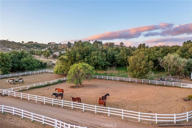 41605 De Portola Rd, Temecula, CA 92592 - yard at dusk featuring a view of countryside and an outdoor riding arena