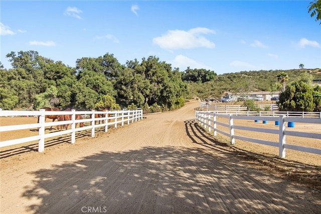 41605 De Portola Rd, Temecula, CA 92592 - view of dirt / gravel road featuring a wooded view and a rural view