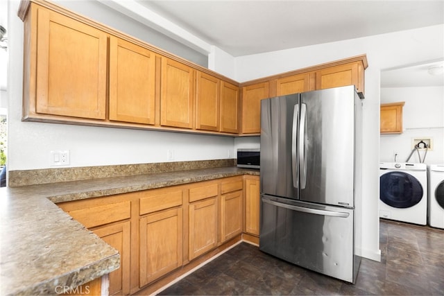 41605 De Portola Rd, Temecula, CA 92592 - kitchen with stainless steel appliances, washer and dryer, and brown cabinetry