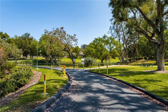 8009 E Eucalyptus Trl, Orange, CA 92869 - surrounding community with a lawn and view of scattered trees
